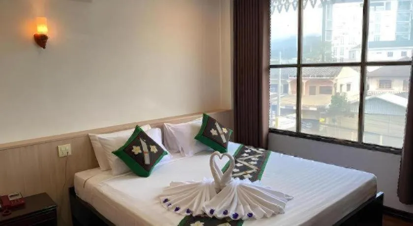 Bed in Anoulack Khen Lao Hotel