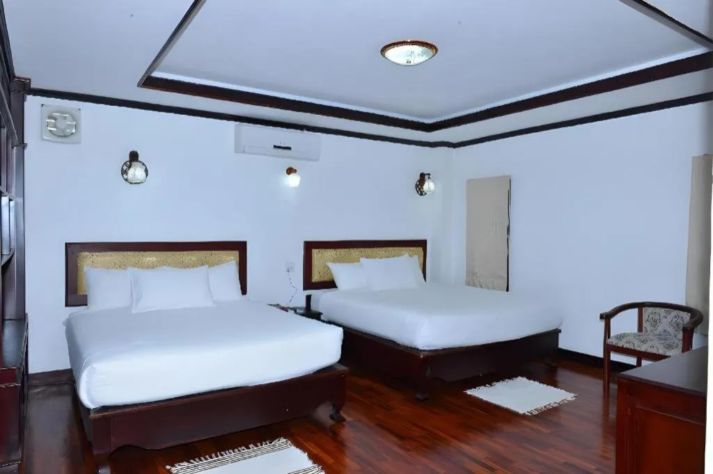 Bed in Anoulack Khen Lao Hotel