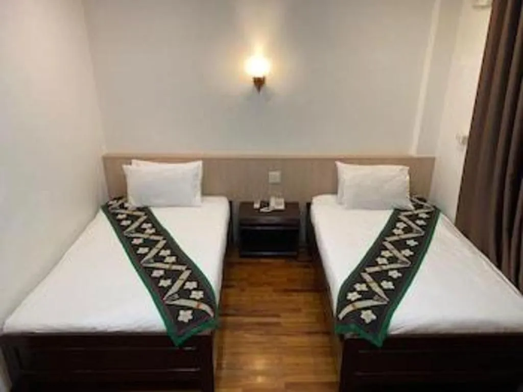 Bed in Anoulack Khen Lao Hotel