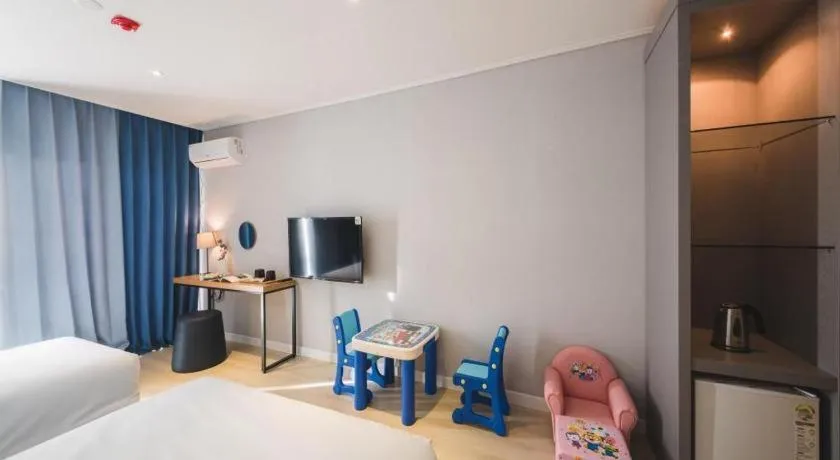 Bed in Sallys Jeju Hotel