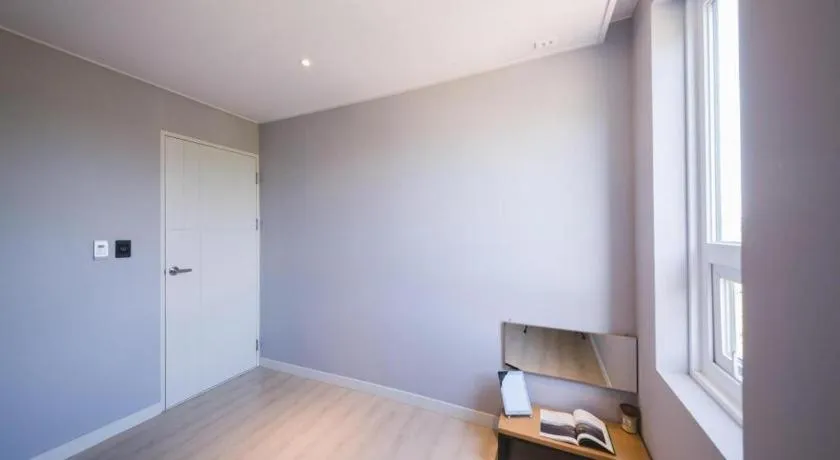 Bed in Sallys Jeju Hotel