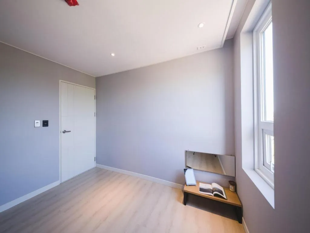 Bed in Sallys Jeju Hotel