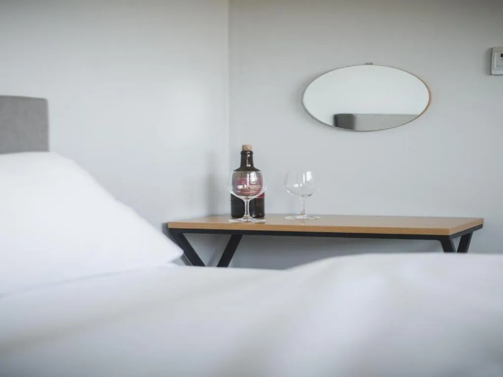 Bed in Sallys Jeju Hotel