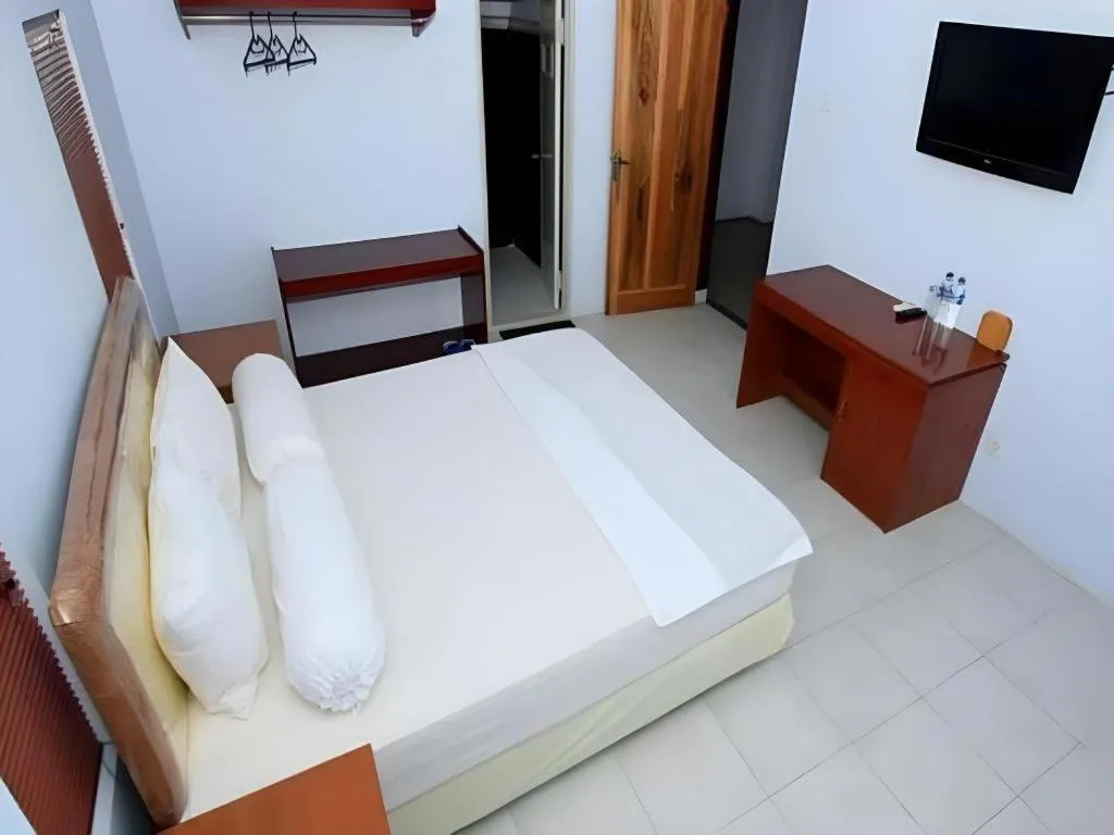 Bed in Hotel New Melati