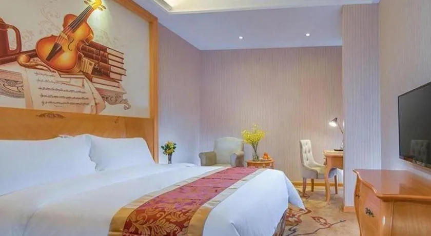Bed in Vienna Hotel Shenzhen Longgang Dayun Center Branch