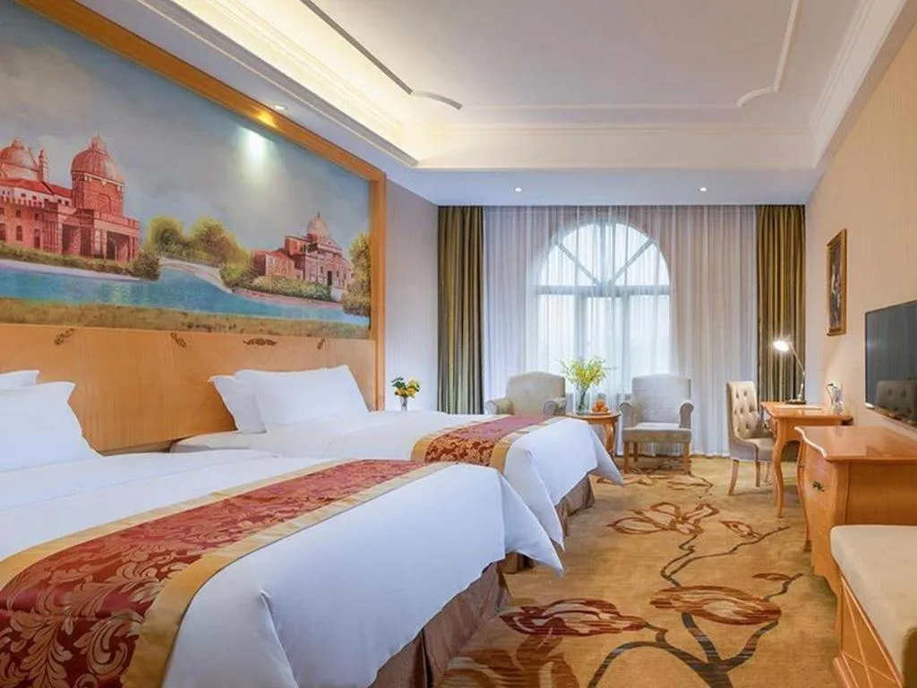 Bed in Vienna Hotel Shenzhen Longgang Dayun Center Branch