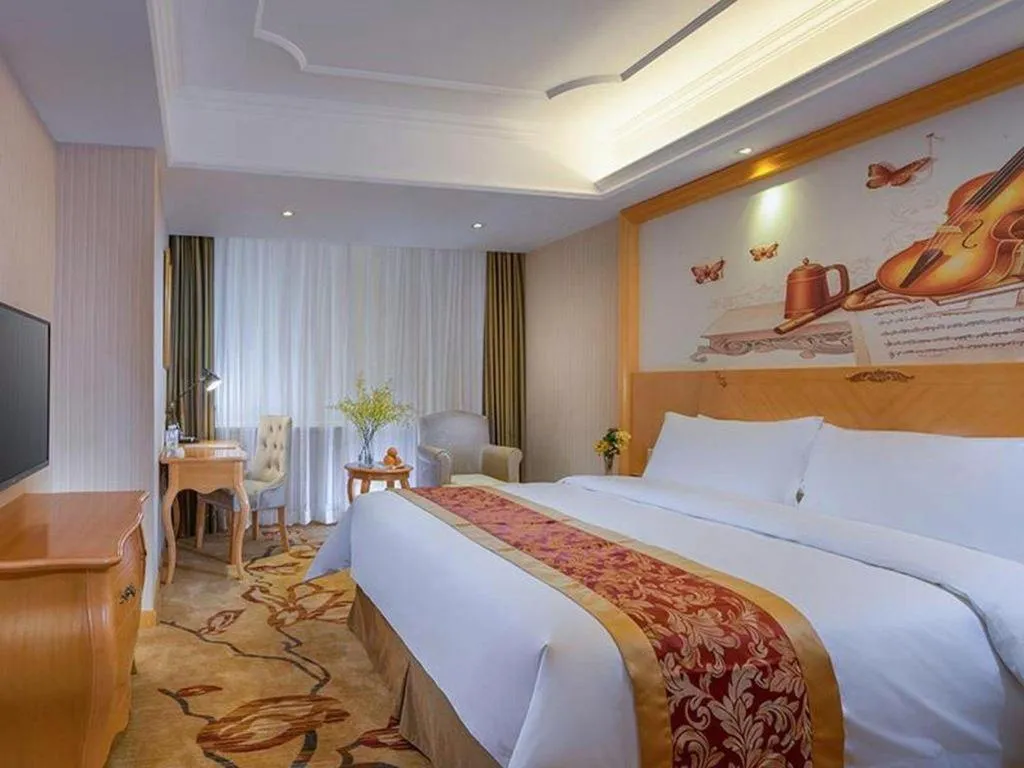 Bed in Vienna Hotel Shenzhen Longgang Dayun Center Branch