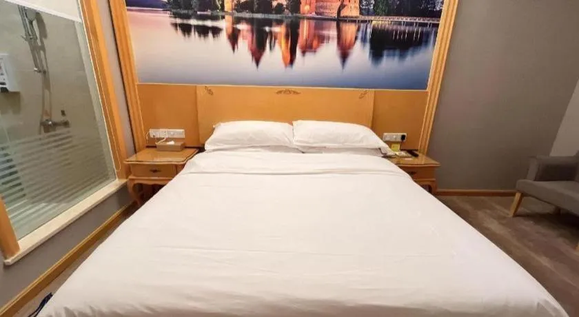 Bed in Vienna Hotel Shenzhen Longgang Dayun Center Branch