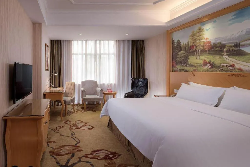 Bed in Vienna Hotel Shenzhen Longgang Dayun Center Branch