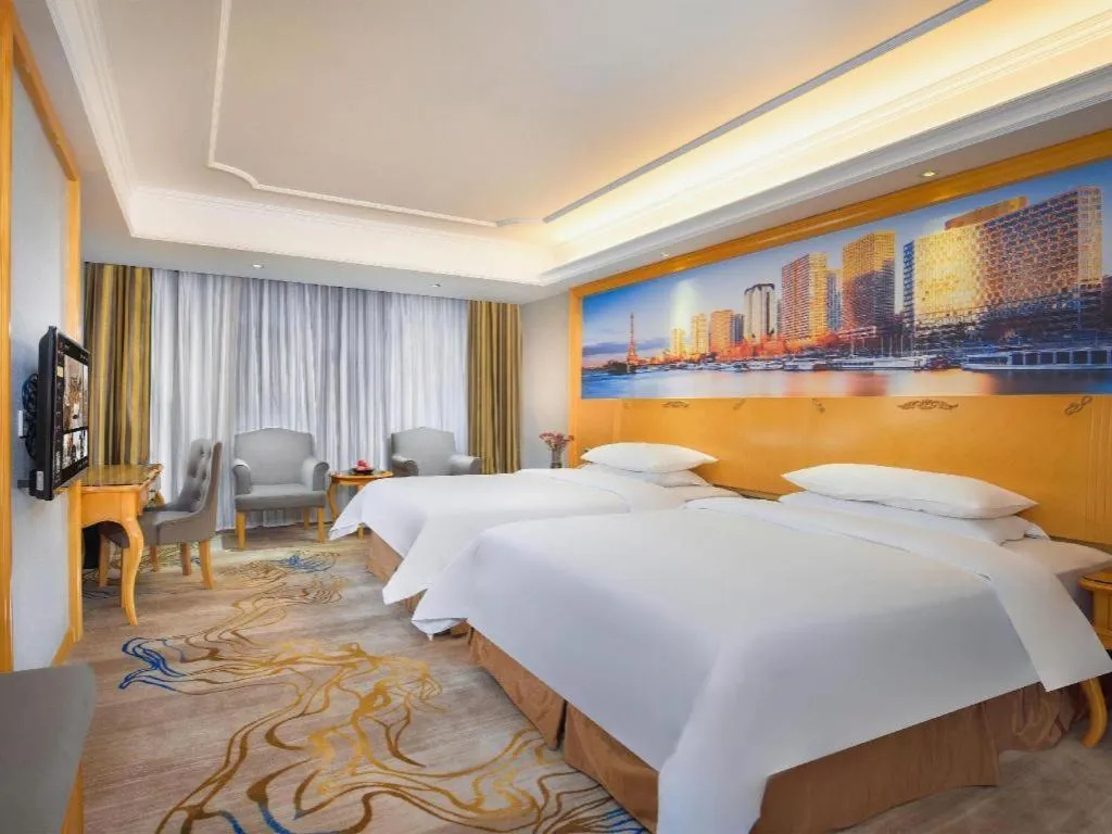 Bed in Vienna Hotel Shenzhen Longgang Dayun Center Branch