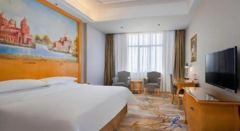 Bed in Vienna Hotel Shenzhen Longgang Dayun Center Branch