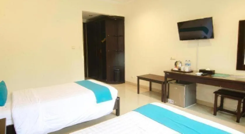 Bed in Ole Suite Hotel and Cottage