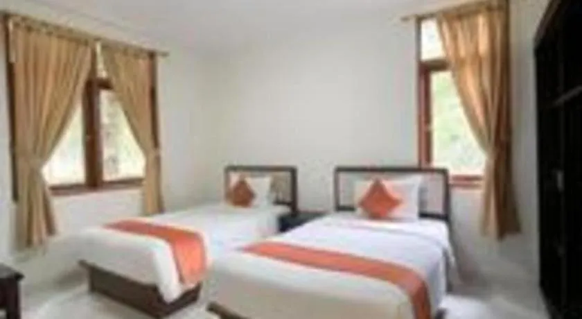 Bed in Ole Suite Hotel and Cottage