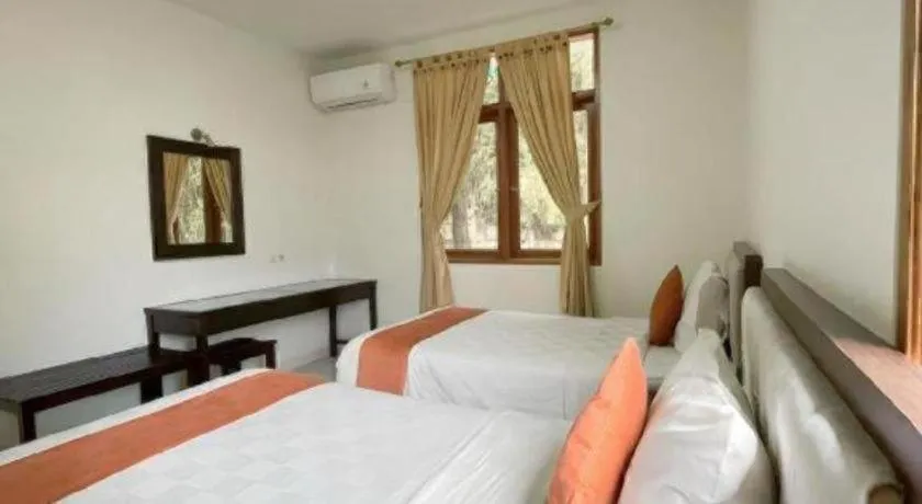 Bed in Ole Suite Hotel and Cottage