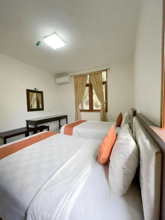 Bed in Ole Suite Hotel and Cottage