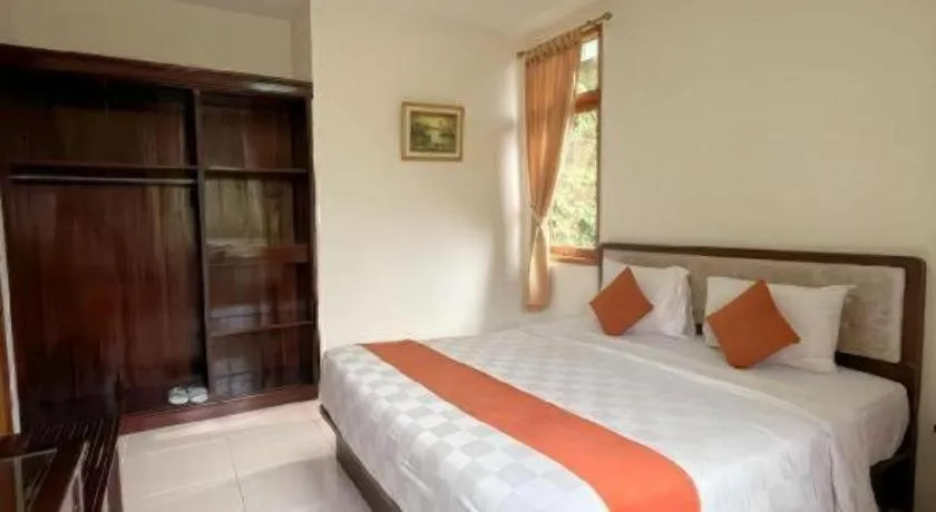 Bed in Ole Suite Hotel and Cottage