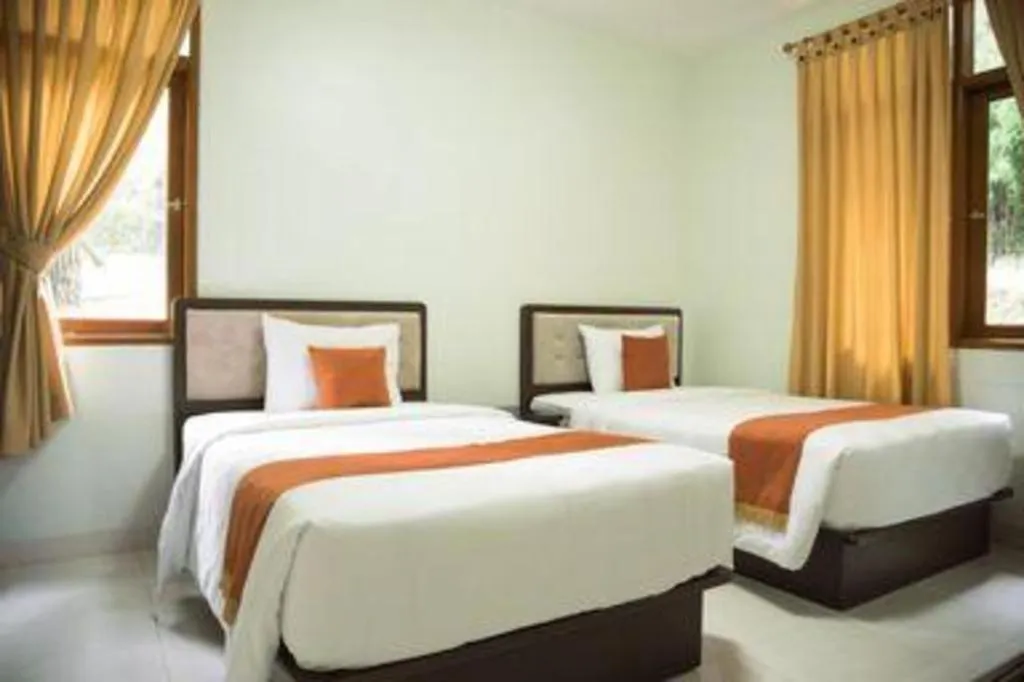 Bed in Ole Suite Hotel and Cottage