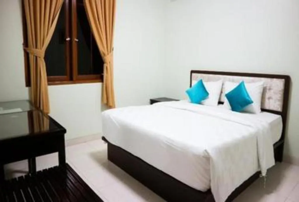 Bed in Ole Suite Hotel and Cottage