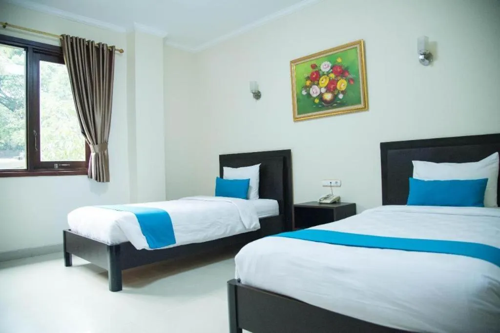 Bed in Ole Suite Hotel and Cottage