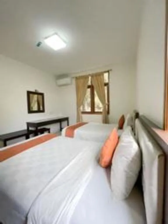 Bed in Ole Suite Hotel and Cottage