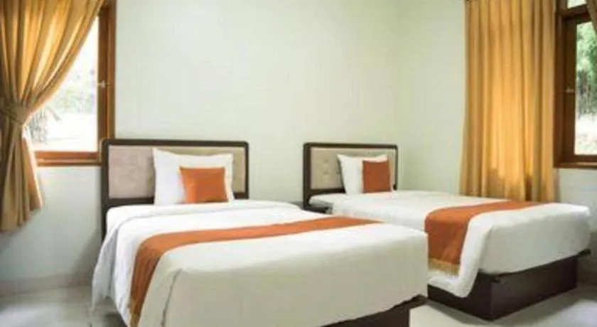 Bed in Ole Suite Hotel and Cottage