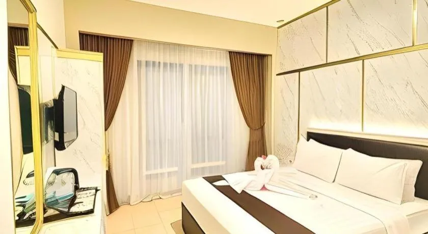 Bed in Grand Malioboro Yogyakarta