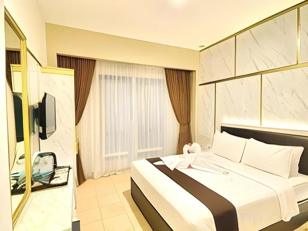 Bed in Grand Malioboro Yogyakarta