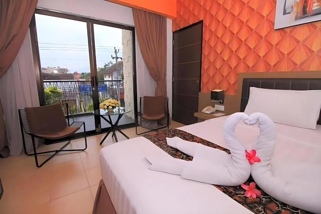 Bed in Grand Malioboro Yogyakarta