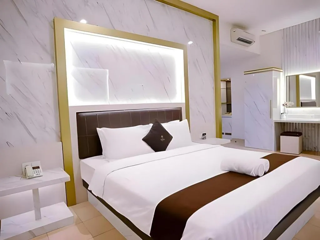 Bed in Grand Malioboro Yogyakarta