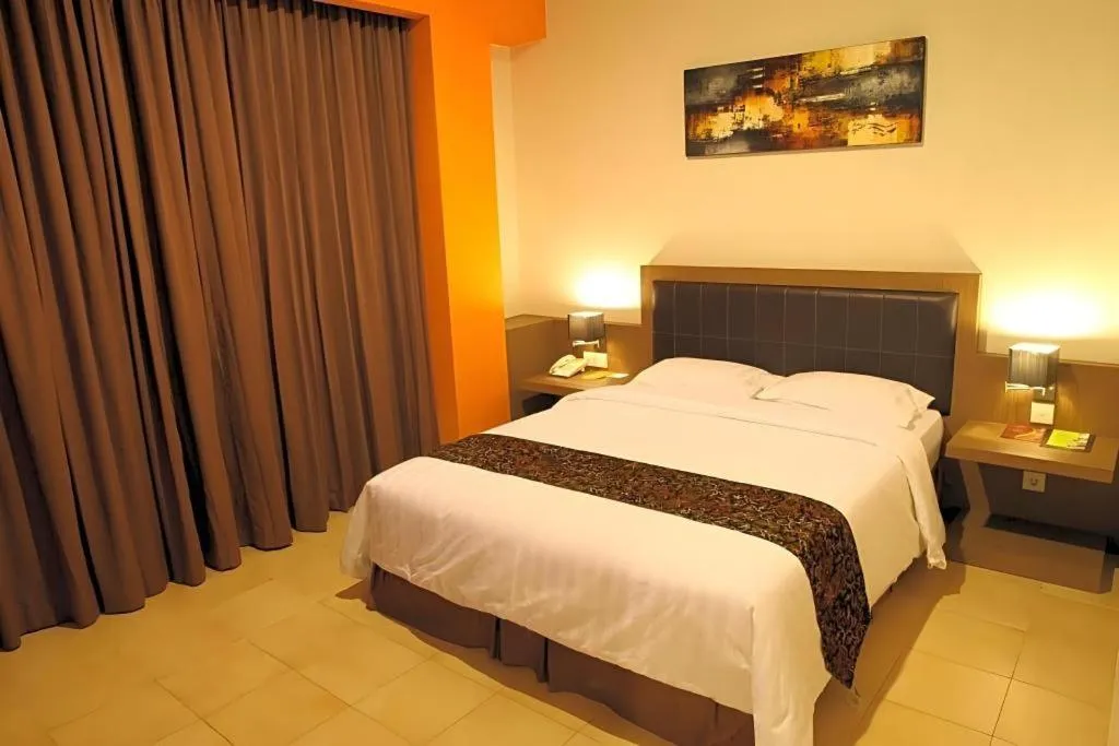 Bed in Grand Malioboro Yogyakarta