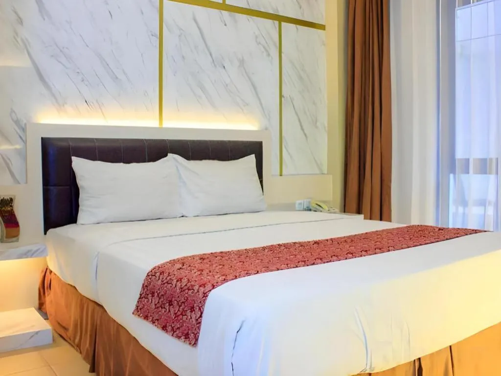 Bed in Grand Malioboro Yogyakarta