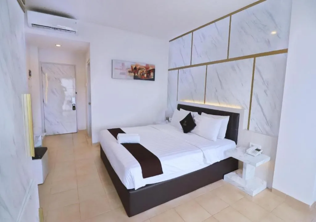 Bed in Grand Malioboro Yogyakarta