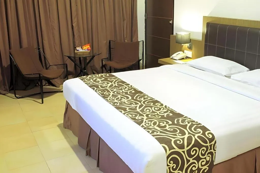 Bed in Grand Malioboro Yogyakarta