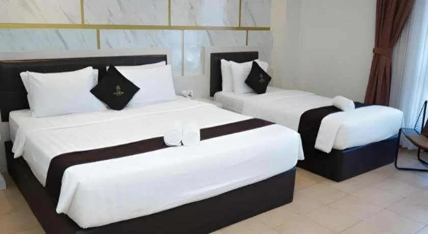 Bed in Grand Malioboro Yogyakarta