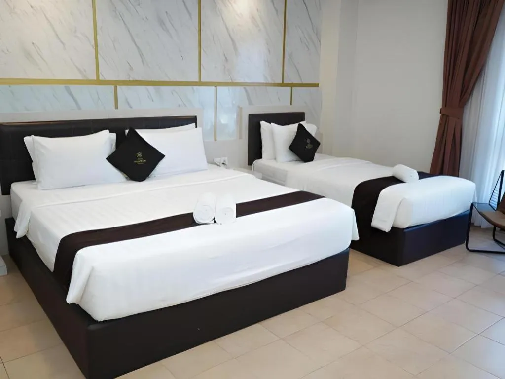 Bed in Grand Malioboro Yogyakarta