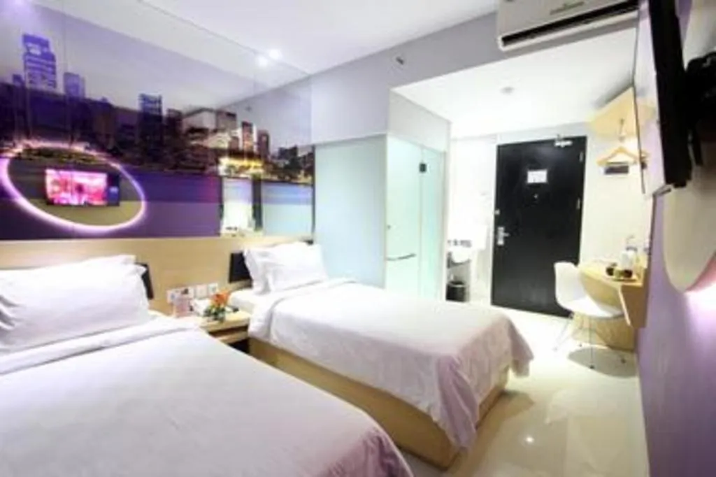 Bed in G Suites Hotel By AMITHYA
