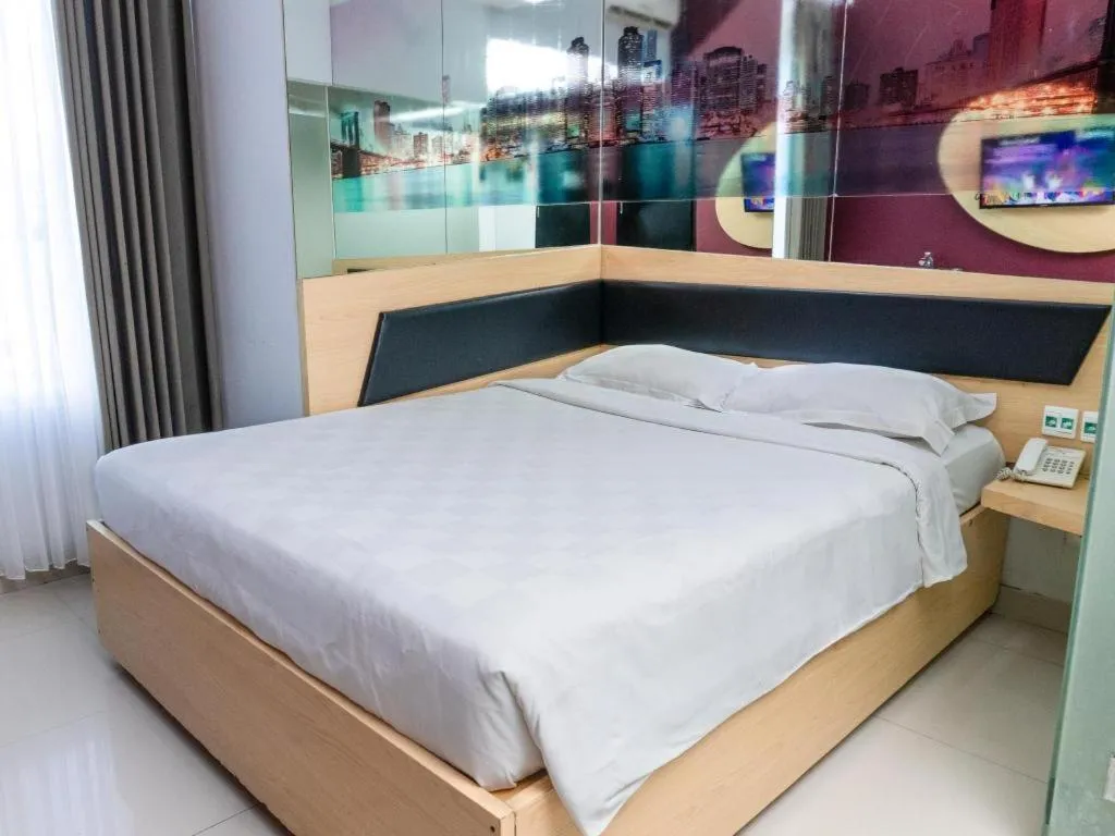 Bed in G Suites Hotel By AMITHYA