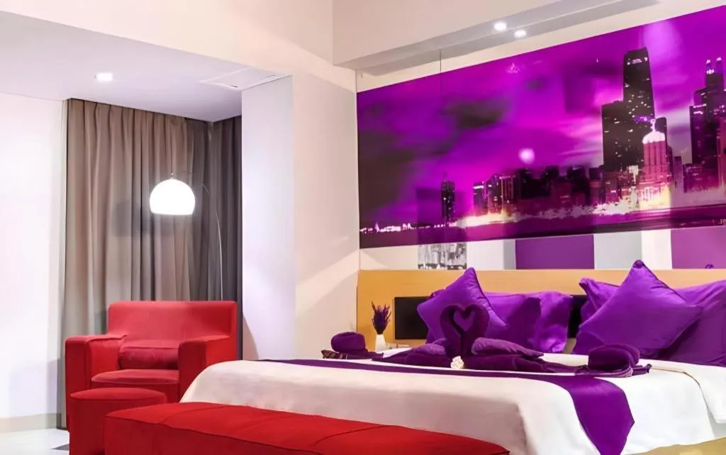 Bed in G Suites Hotel By AMITHYA