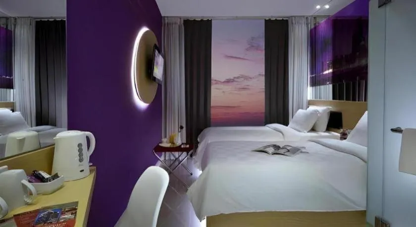 Bed in G Suites Hotel By AMITHYA