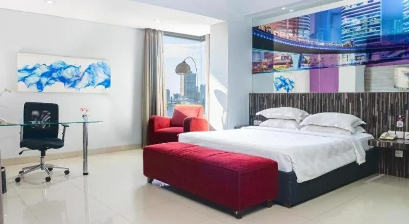 Bed in G Suites Hotel By AMITHYA