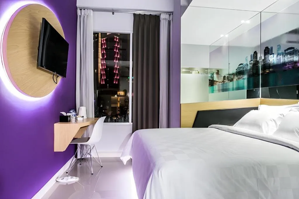 Bed in G Suites Hotel By AMITHYA