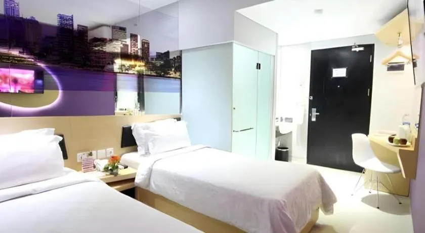 Bed in G Suites Hotel By AMITHYA