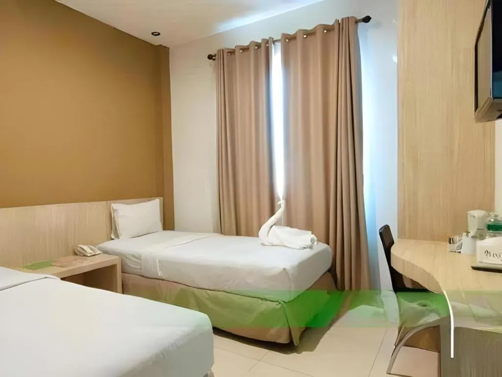 Bed in HW Hotel Padang
