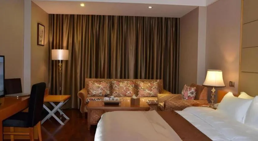 Bed in San Jiang Grand Hotel