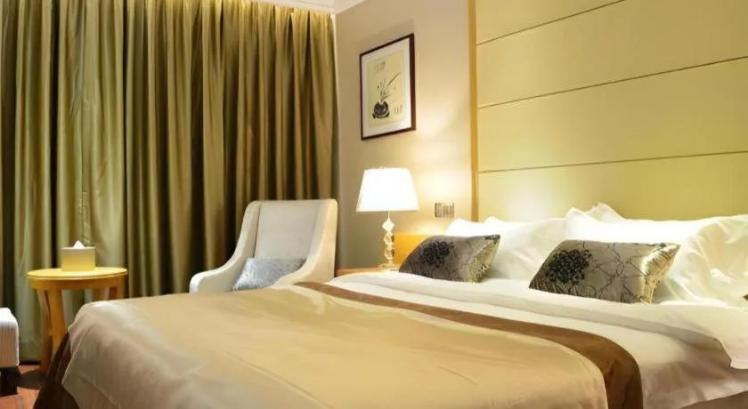 Bed in San Jiang Grand Hotel