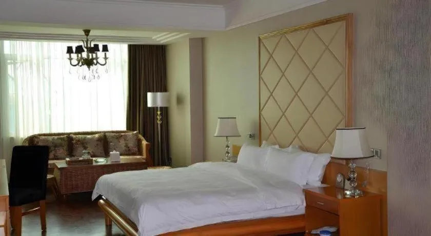 Bed in San Jiang Grand Hotel