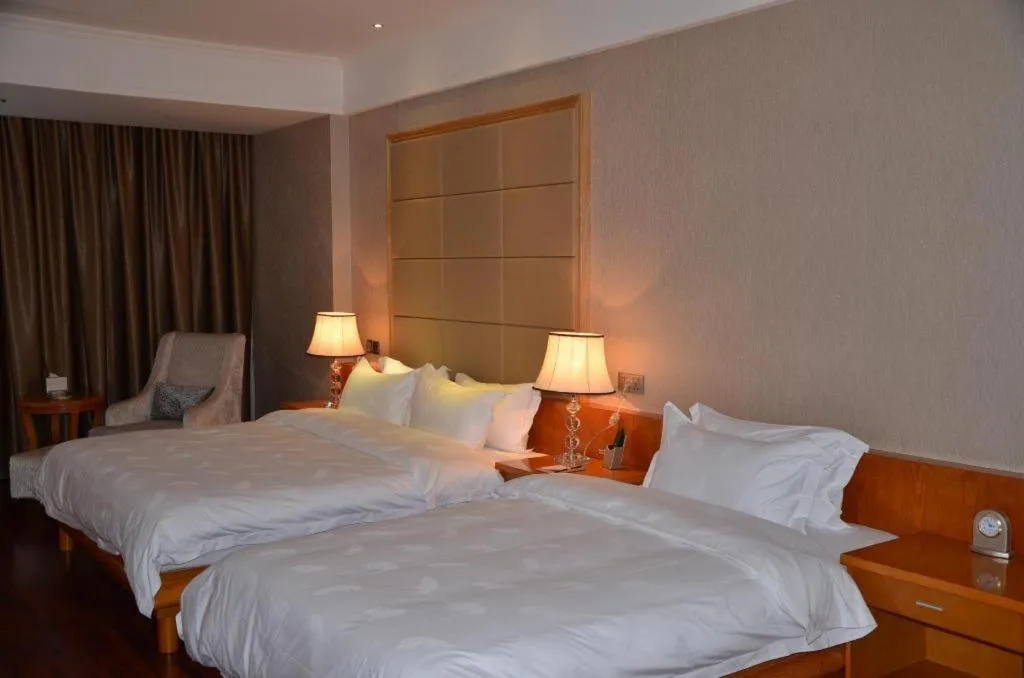 Bed in San Jiang Grand Hotel