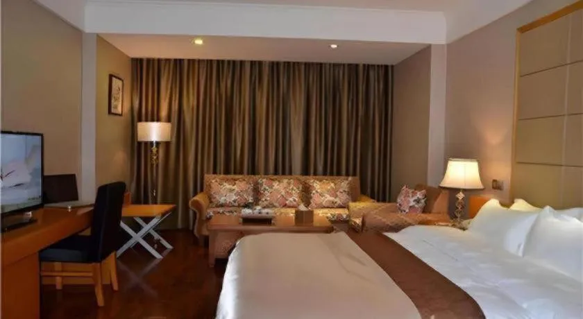 Bed in San Jiang Grand Hotel