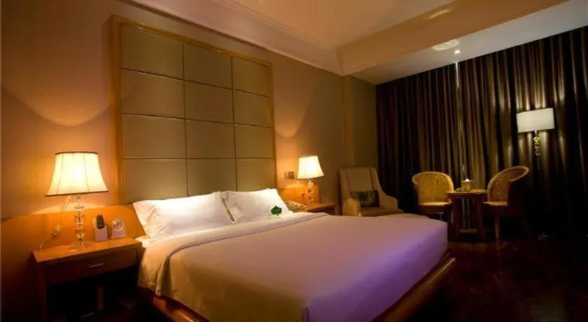 Bed in San Jiang Grand Hotel