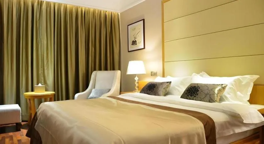 Bed in San Jiang Grand Hotel